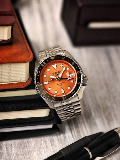 Seiko 5 Sports Automatic GMT Watch – Orange Dial with Black & Gold Bezel